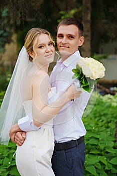 Gentle and happy newlyweds on a walk in the park.