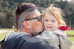 Gentle hugs dad with daughter. Tender relationship of father to daughter. Positive emotions. Tenderness and parental love. Feeling