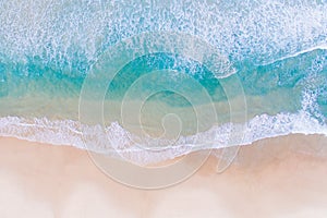 Gentle sea waves on the beach and clear water