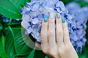 Gentle summer manicure in blue tones. Manicure on short nails gel Polish