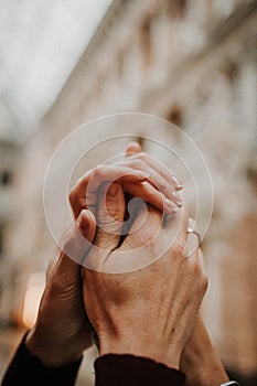 A gentle touch of the hands of a man and a woman close-up.