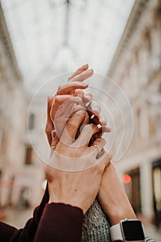 A gentle touch of the hands of a man and a woman close-up.