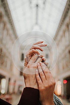 A gentle touch of the hands of a man and a woman close-up.