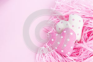 Gentle Valentine`s Day background. Hearts on a pink background. Happy holiday greetings concept. Place for text.