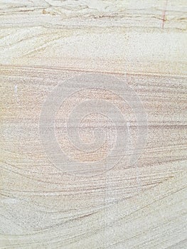 Gentle, water-like patterns in sandstone.