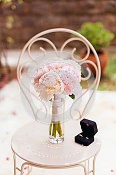 Gentle wedding bouquet peonies with rings