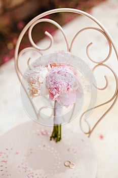 Gentle wedding bouquet peonies with rings