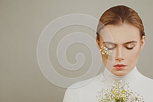 Gentle young woman with flowers, hope concept