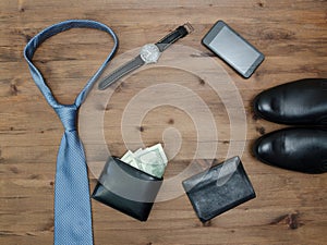 Gentleman concept. tie dollars watches smartphone and shoes