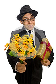 Gentleman with gift box and flowers isolated on