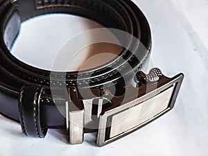 Gentleman leather belt on a white background