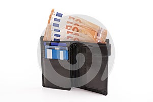 Gentleman's wallet with banknotes peeking out and credit cards isolated on white background