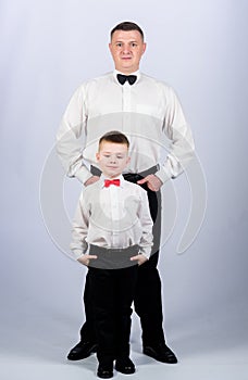 Gentleman in tuxedo style. father and son in formal suit. happy child with father. business meeting party. small boy