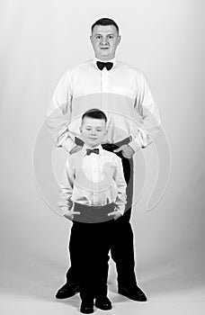 Gentleman in tuxedo style. father and son in formal suit. happy child with father. business meeting party. small boy