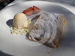 Genuine apple strudel with ice cream