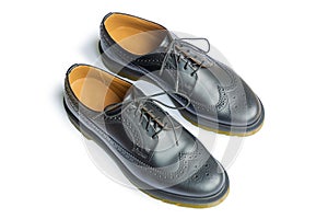 A genuine leather black brogues isolated on a white background. Smart casual style shoes photo