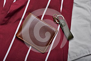 Genuine leather wallet, Handcraft full grain brown bifold wallet on shirt background, Men fashion