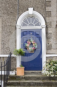 A Geoargian styled panelled door and concrete surround in Hillsborough Village