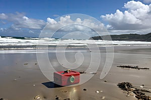 geocaching treasure hunt on secluded beach, with the waves rolling in