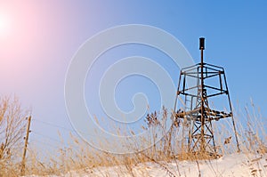 Geodesic sign on a background of a blue sky in winter
