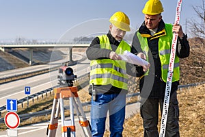 Geodesist read plans on construction site