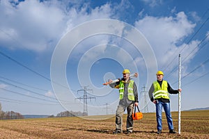 Geodesist two man equipment on construction site