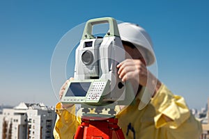 geodesy specialist works on a construction site