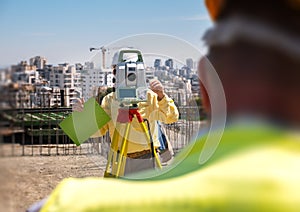 geodesy specialist works on a construction site