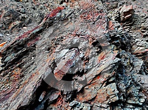 Geodesy. Stone texture. The rock is brown and red. Mineral background. Design from natural materials.