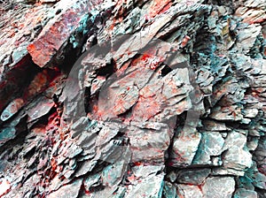 Geodesy. Stone texture. The rock is brown and red. Mineral background. Design from natural materials.