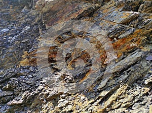 Geodesy. Stone texture. The rock is brown and red. Mineral background. Design from natural materials.