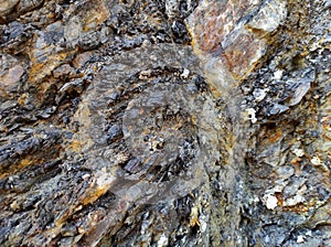 Geodesy. Stone texture. The rock is brown and red. Mineral background. Design from natural materials.