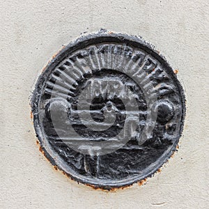 Geodetic sign benchmark, cast-iron levelling mark in the wall