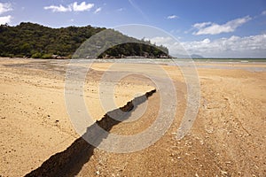 Geoffrey Bay beach next to a body of water on Magnetic Island in Townsville in Australia