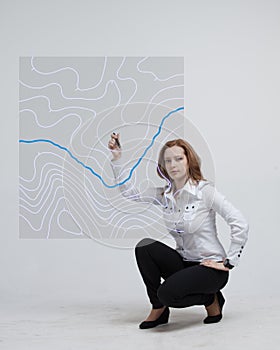 Geographic information systems concept, woman scientist working with futuristic GIS interface on a transparent screen.