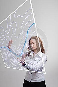 Geographic information systems concept, woman scientist working with futuristic GIS interface on a transparent screen.