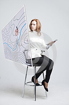 Geographic information systems concept, woman scientist working with futuristic GIS interface on a transparent screen.