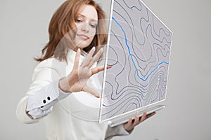 Geographic information systems concept, woman scientist working with futuristic GIS interface on a transparent screen.