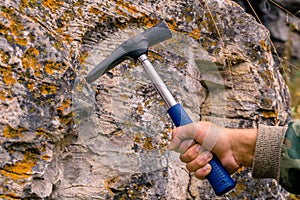Geological hammer in hand