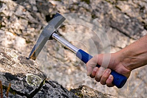 Geological hammer in hand