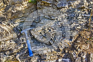 Geological hammer on the rocks