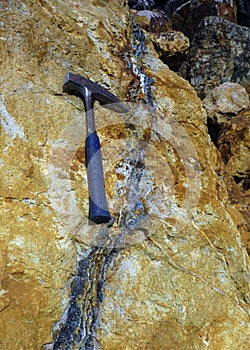 Geological pick and hydrothermal vein photo
