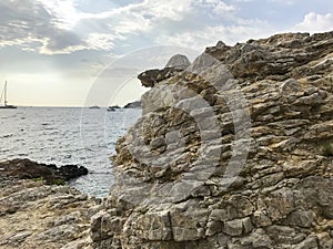 Geological rocks, sea stones on seashore. Photo