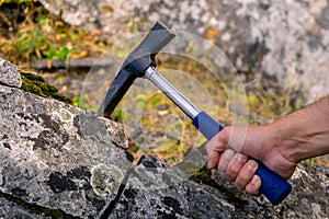 Geological hammer in hand