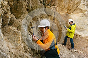 Geologists against the rocks in the canyon