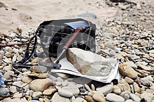 Geologists bag with the stones and notes papers and hammer. Geology science concept