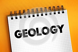 Geology is a branch of natural science concerned with Earth and other astronomical objects, text concept on notepad