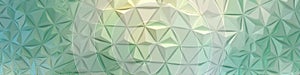 Geometric abstract background with green and yellow triangular patterns