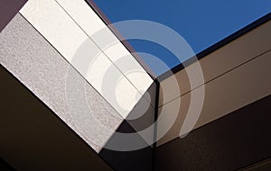 Geometric abstraction brown wall shadow and sky