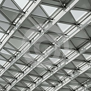 Geometric architectural structure featuring a grid of triangular glass panels in a